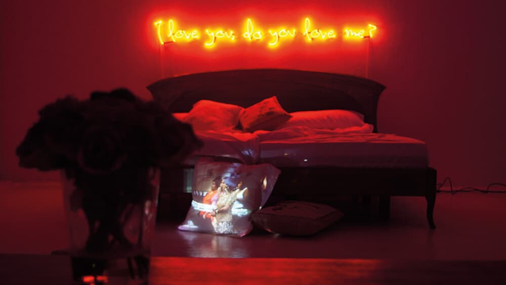 Owanto, I love you, do you love me?, 2015. Installation [bed, neon and slideshow projecting onto pillow] and Photography, dimensions variable. 