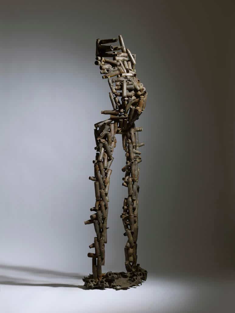 Freddy Tsimba, On a marché dans la forêt, 2005. Mixed technique, recovery, welding sockets, moulded monkey skulls, 182 x 49 x 40 cm. Courtesy of Beaux Arts London.