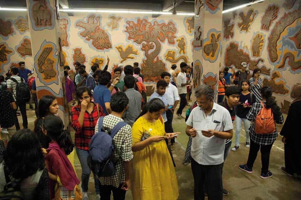 Durgabai and Subhash Vyam, installation view with crowds at Kochi-Muziris Biennale 2018. Courtesy of Kochi Biennale Foundation