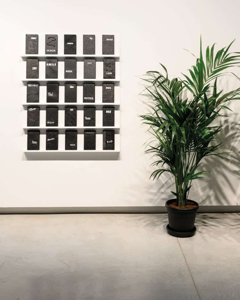 Candice Breitz, Digest. 2019. Multi-channel video installation, wooden shelves, videotape, polypropylene boxes, paper, acrylic paint 300 units: 20.3 x 12 x 2.7 cm each. Commissioned by Sharjah Art Foundation. Courtesy of Goodman Gallery, Johannesburg; Kaufmann Repetto, Milan and KOW, Berlin 