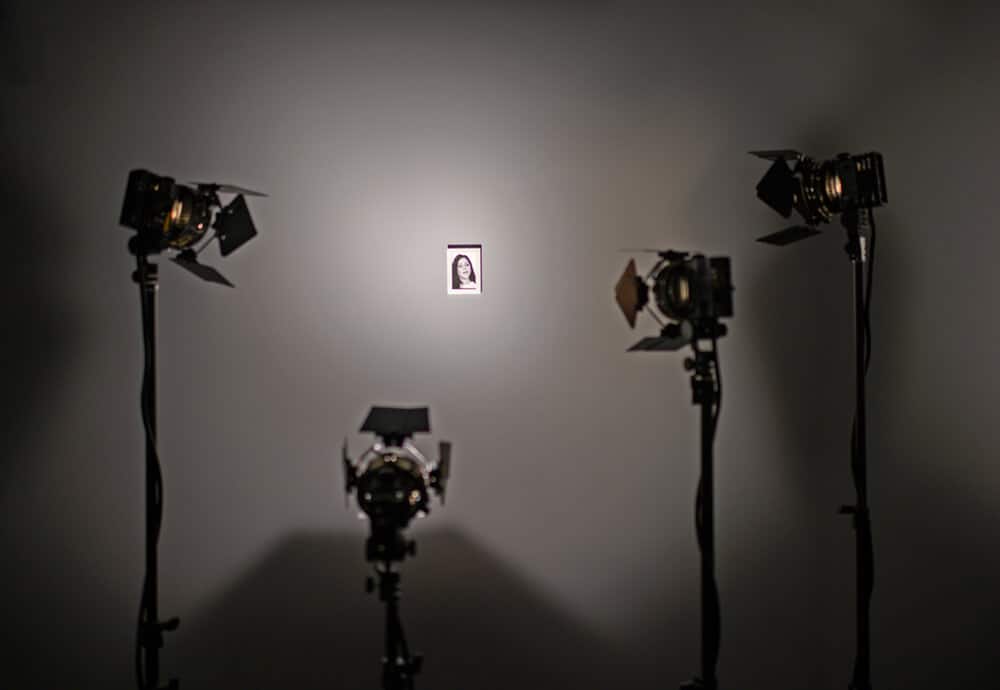 Alfredo Jaar, 33 women. 2014-2019. 33 framed pigment prints, 198 light projectors, 198 tripods. Dimensions variable. Commissioned by Sharjah Art Foundation. Courtesy of the artist