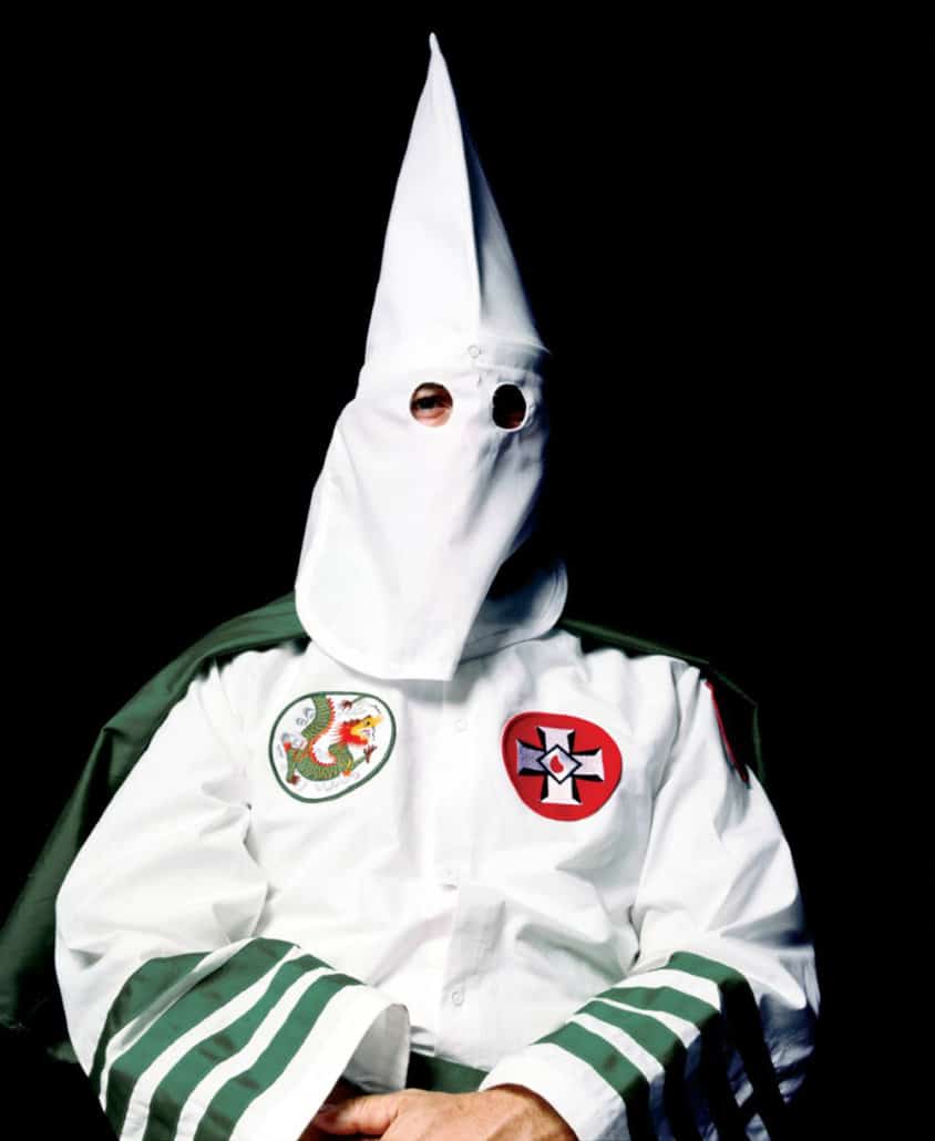 Cuban artist Andres Serrano is a descendant of the Africans who were kidnapped and forced into slavery in the New World. Serrano's portrait of the Ku Klux Klan grand masters inverts the cliché about masking traditions as the black man photographs white supremacists on the other side of the mask.